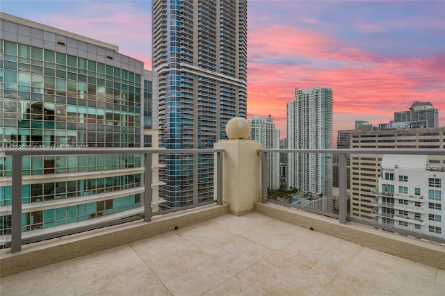 view of balcony at dusk