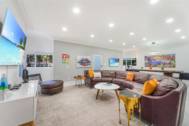 carpeted living room featuring ornamental molding