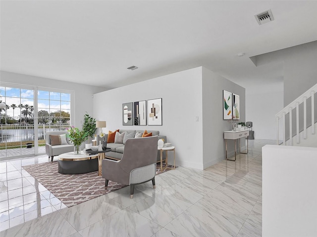 living room featuring a water view