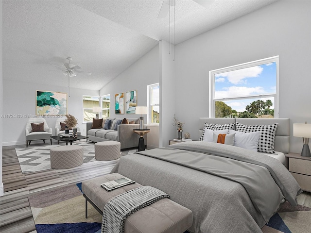 bedroom featuring ceiling fan, high vaulted ceiling, multiple windows, and a textured ceiling