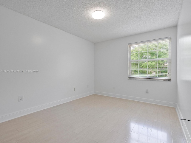 empty room with a textured ceiling