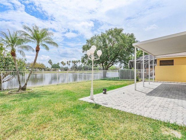 view of yard featuring a patio area and a water view