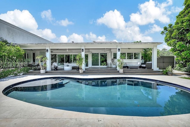 view of pool with outdoor lounge area and a patio