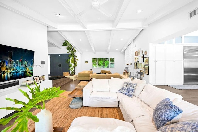 living room with wood-type flooring, ceiling fan, and beamed ceiling