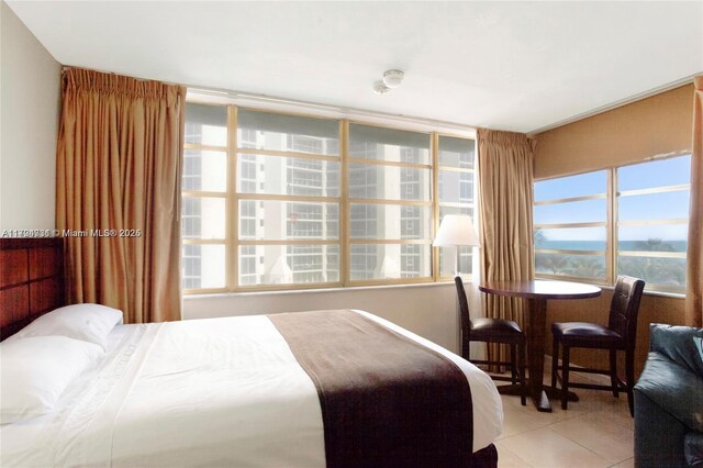 bedroom featuring light tile patterned floors