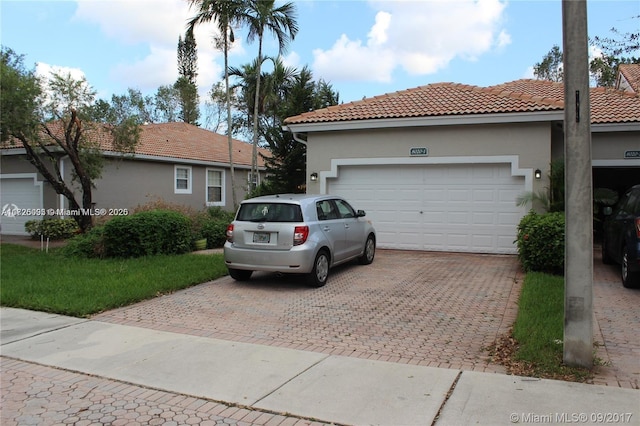 view of side of home featuring a garage