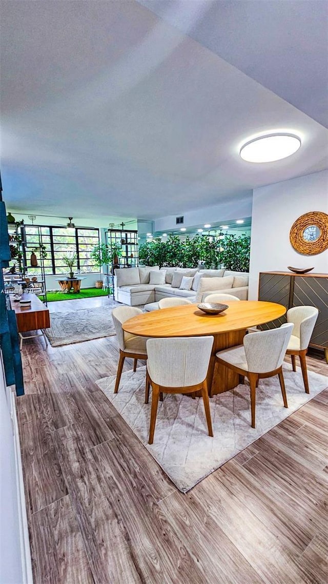 dining area with light hardwood / wood-style flooring