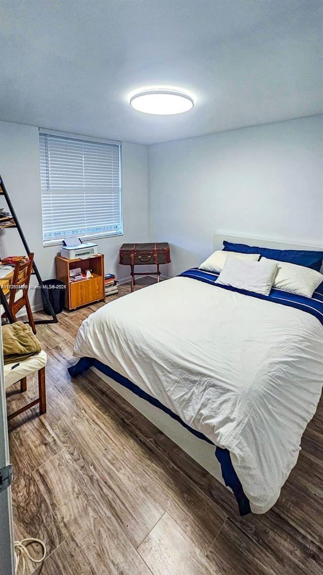 bedroom featuring hardwood / wood-style flooring