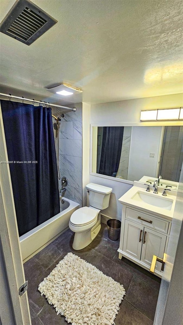 full bathroom with toilet, a textured ceiling, shower / tub combo, and vanity