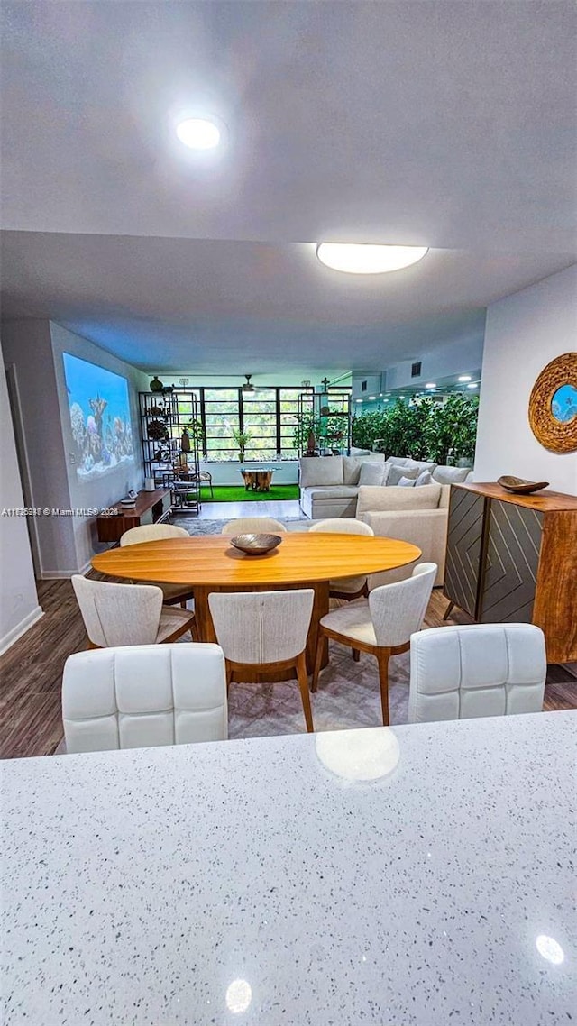 dining area featuring hardwood / wood-style flooring