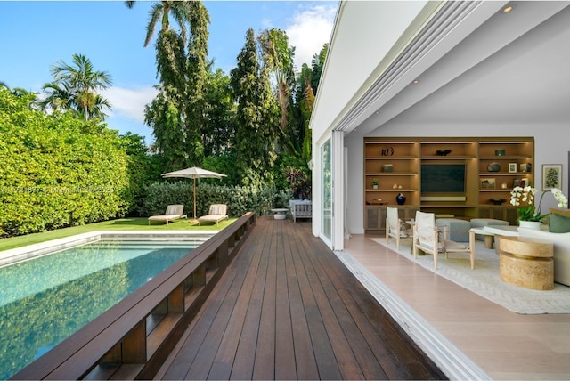 view of swimming pool featuring a wooden deck