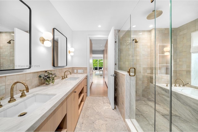 bathroom featuring vanity and a shower with door