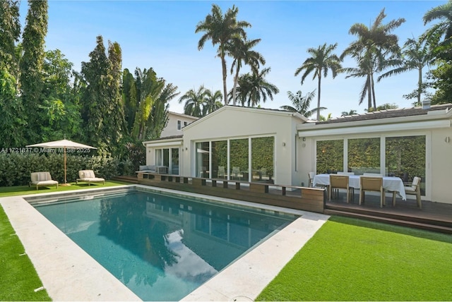 view of swimming pool featuring a deck