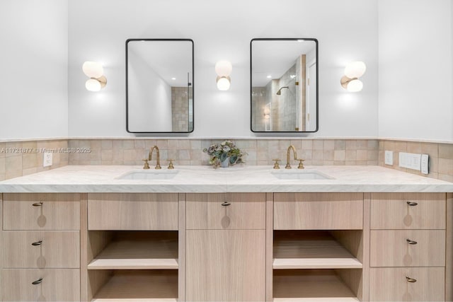 bathroom featuring vanity and backsplash