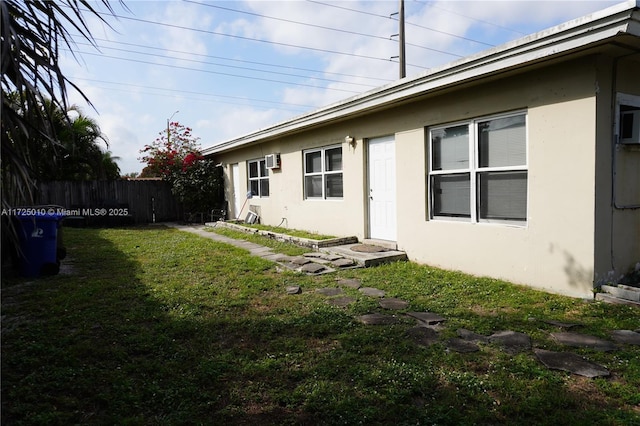 back of house featuring a yard