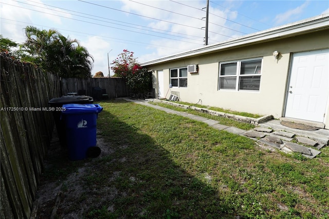 view of yard featuring a wall mounted AC