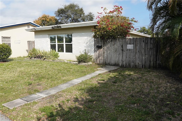 view of home's exterior featuring a lawn