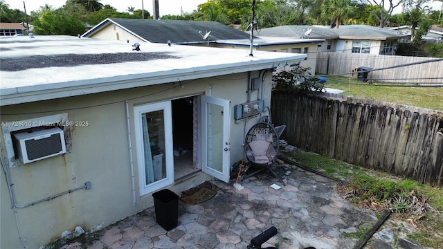 exterior space with cooling unit and a patio area