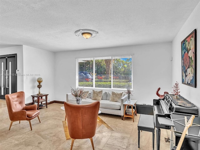 living room featuring a textured ceiling