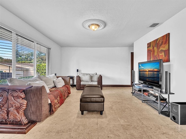 living room with a textured ceiling