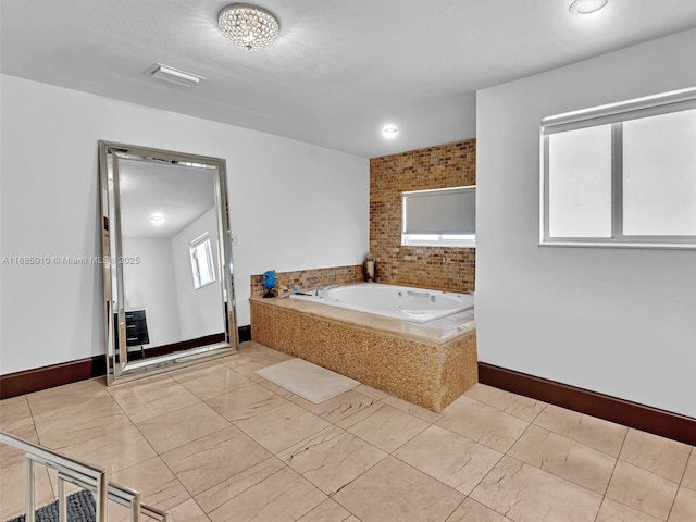 bathroom with tiled tub