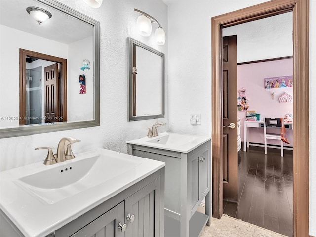 bathroom with hardwood / wood-style floors and vanity