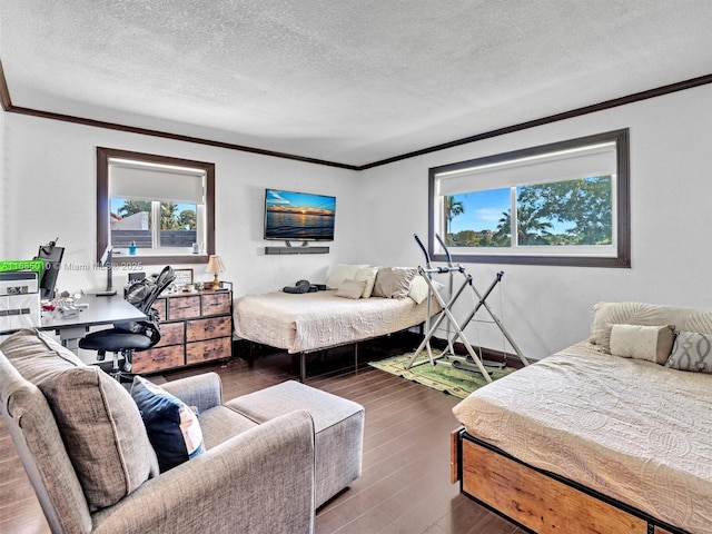 bedroom with a textured ceiling, crown molding, and dark hardwood / wood-style floors