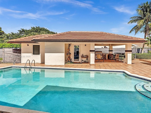 view of swimming pool with a patio and area for grilling