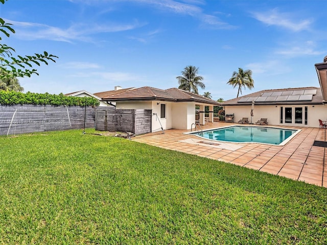 view of pool featuring a patio and a lawn