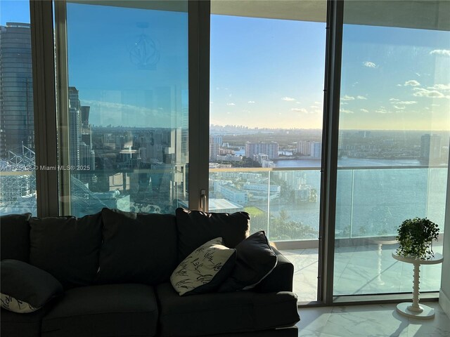 living room featuring expansive windows and plenty of natural light