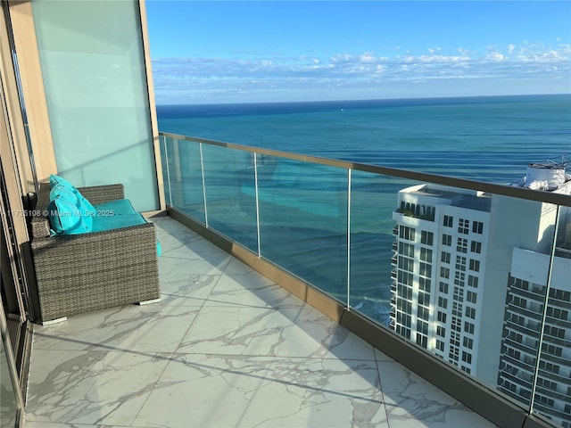 balcony featuring a water view