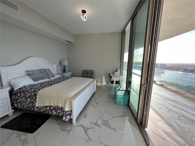 bedroom featuring floor to ceiling windows