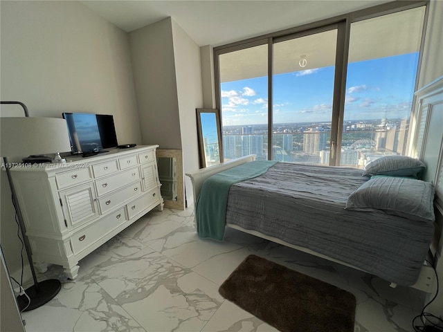 bedroom with multiple windows and expansive windows