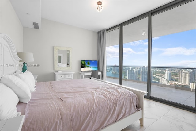 bedroom with access to exterior, visible vents, a wall of windows, and marble finish floor