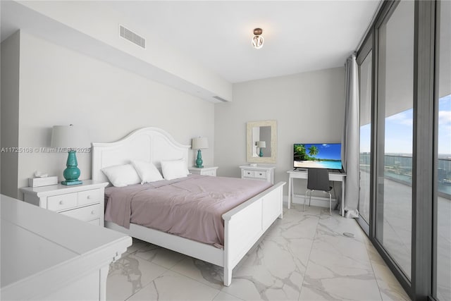 bedroom with expansive windows, marble finish floor, and visible vents