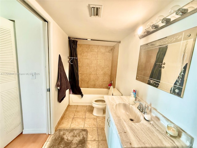 full bathroom with toilet, tile patterned floors, vanity, and shower / bath combo with shower curtain