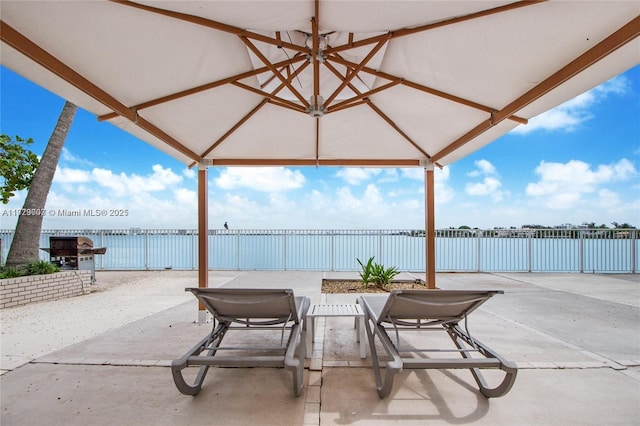 view of patio / terrace with a water view