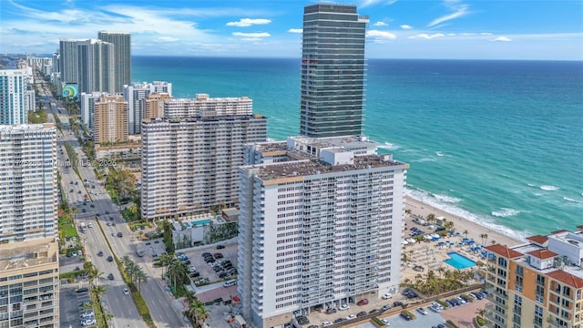 bird's eye view featuring a beach view and a water view