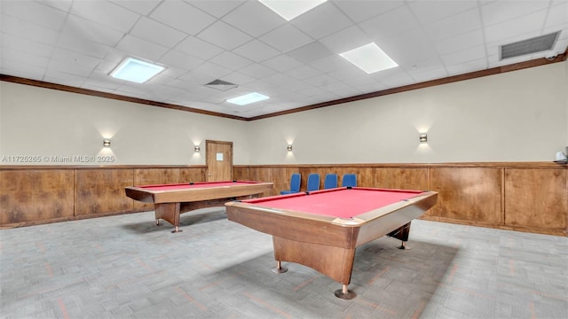 game room with pool table, a drop ceiling, and ornamental molding