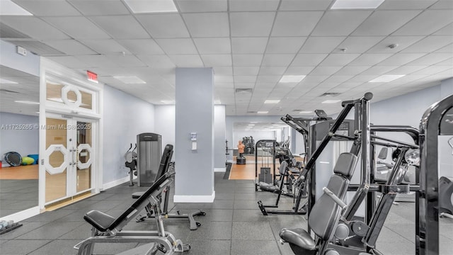 exercise room featuring a paneled ceiling