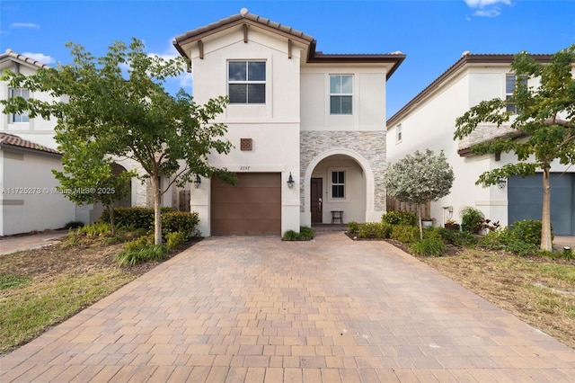 mediterranean / spanish house featuring a garage