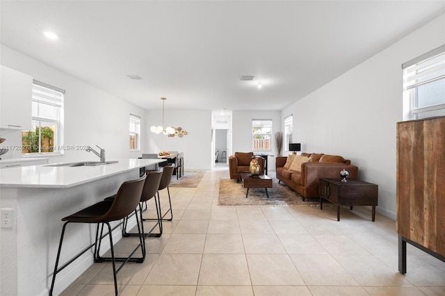 interior space featuring a notable chandelier and sink