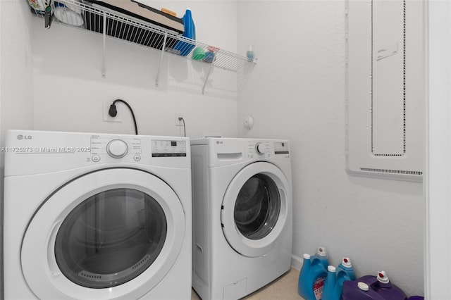 laundry area featuring washing machine and clothes dryer