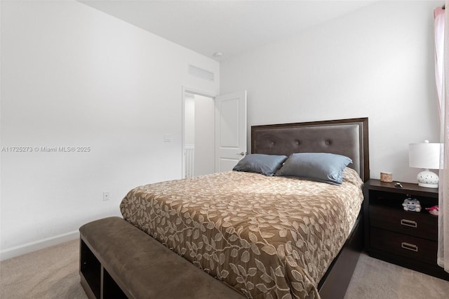 bedroom featuring light carpet