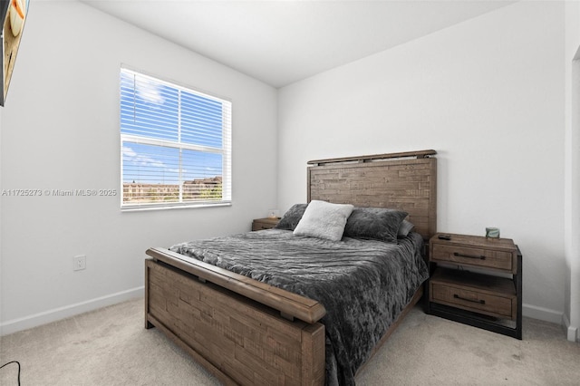 bedroom featuring light carpet