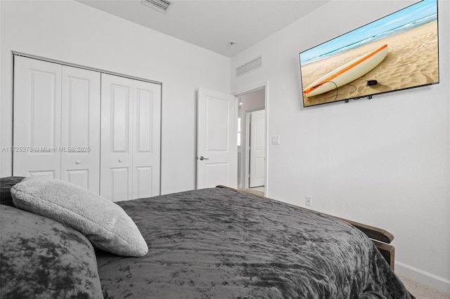 carpeted bedroom featuring a closet