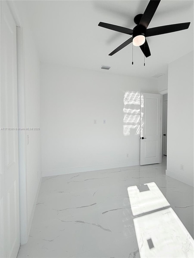 spare room featuring ceiling fan