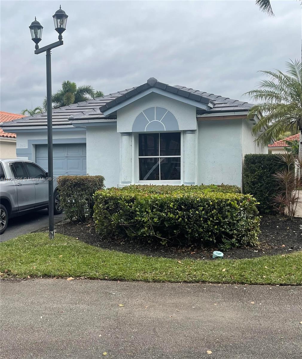 view of front of property with a garage