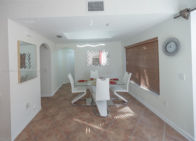 dining space featuring tile patterned floors