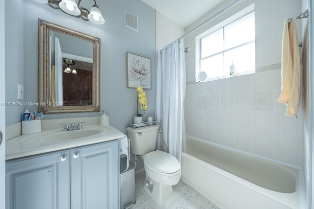 full bathroom featuring toilet, shower / tub combo, vanity, and ceiling fan